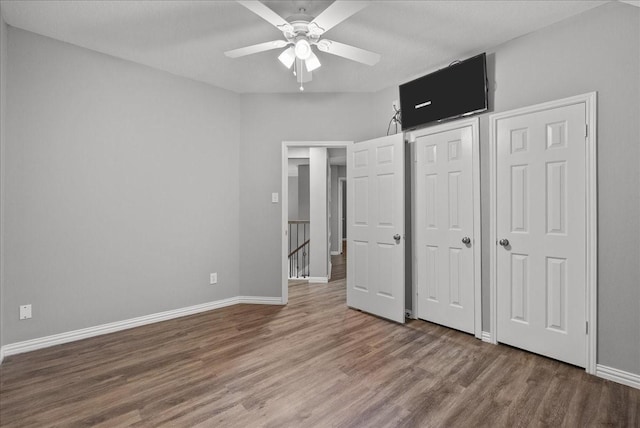 16610 Avenfield Rd, Tomball, TX 77377 - unfurnished bedroom with wood finished floors and a ceiling fan
