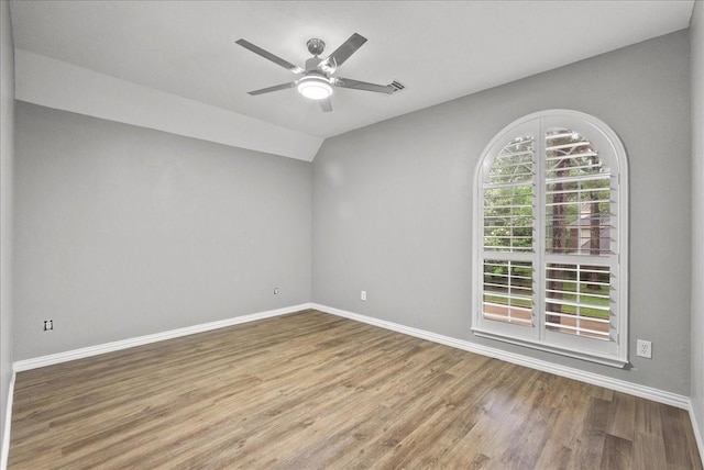 16610 Avenfield Rd, Tomball, TX 77377 - empty room with wood finished floors, a ceiling fan, and vaulted ceiling