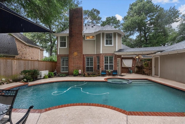 16610 Avenfield Rd, Tomball, TX 77377 - view of swimming pool featuring a fenced backyard, a pool with connected hot tub, and a patio