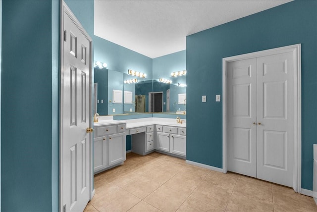 16610 Avenfield Rd, Tomball, TX 77377 - full bathroom featuring vanity, tile patterned floors, and a shower with door