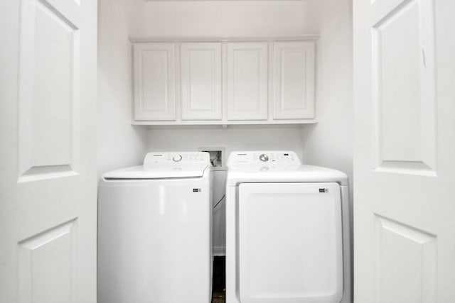12819 Kingsbridge Ln, Houston, TX 77077 - washroom featuring independent washer and dryer and cabinet space