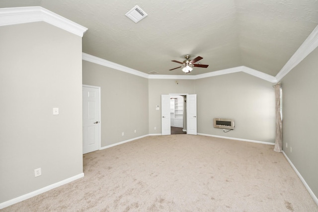 12819 Kingsbridge Ln, Houston, TX 77077 - empty room featuring a ceiling fan, heating unit, crown molding, carpet, and vaulted ceiling
