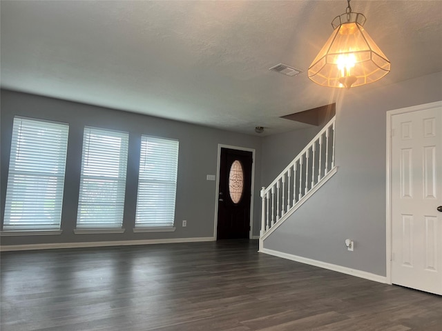 16219 Purpleridge Ct, Houston, TX 77053 - entrance foyer featuring baseboards, stairs, dark wood finished floors, and plenty of natural light