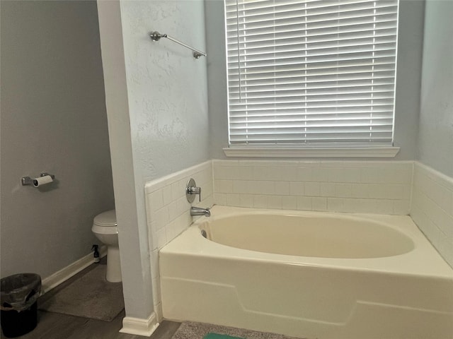 16219 Purpleridge Ct, Houston, TX 77053 - full bathroom featuring a bath, toilet, and wood finished floors