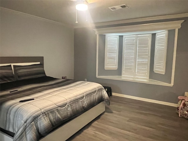16219 Purpleridge Ct, Houston, TX 77053 - bedroom featuring ornamental molding, wood finished floors, and baseboards