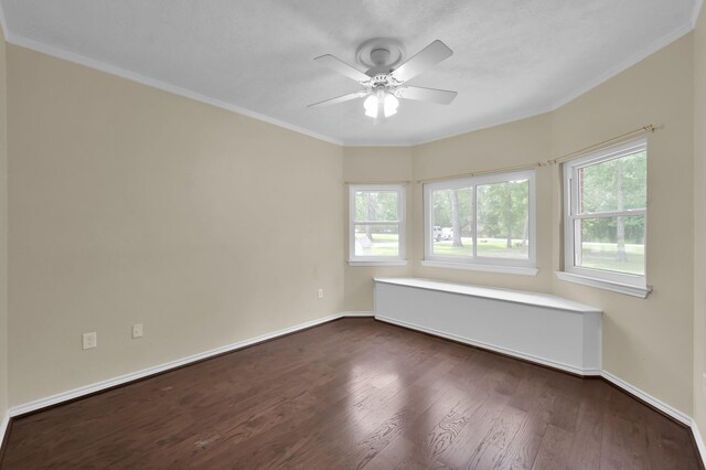 1807 Carriage Hills Blvd, Conroe, TX 77384 - spare room with dark wood-style floors, ceiling fan, healthy amount of natural light, ornamental molding, and baseboards