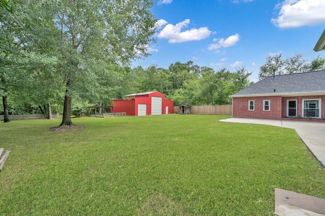 1807 Carriage Hills Blvd, Conroe, TX 77384 - view of yard featuring an outbuilding