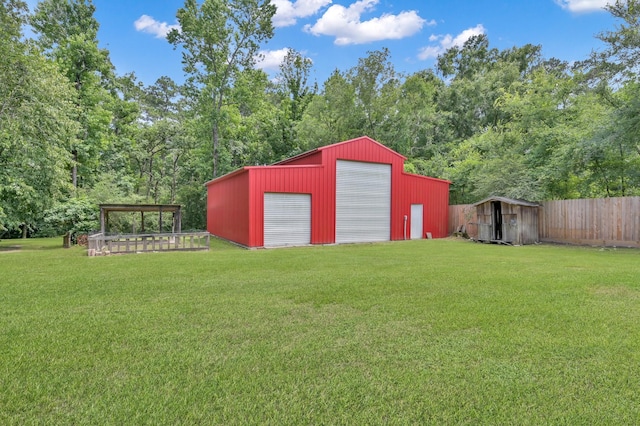1807 Carriage Hills Blvd, Conroe, TX 77384 - view of yard with an outbuilding and a garage