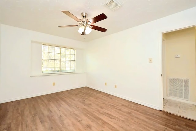 839 Hidden Canyon Rd, Katy, TX 77450 - spare room featuring light wood-type flooring, ceiling fan, and baseboards