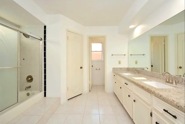 839 Hidden Canyon Rd, Katy, TX 77450 - bathroom featuring double vanity, enclosed tub / shower combo, and tile patterned flooring