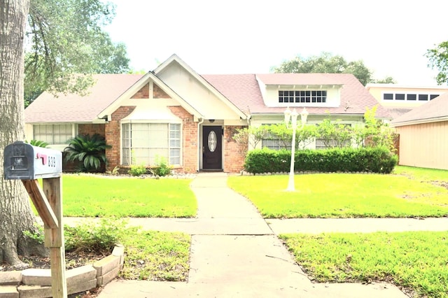 839 Hidden Canyon Rd, Katy, TX 77450 - view of front of home with brick siding and a front lawn