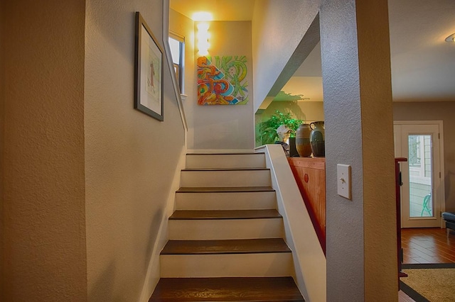 907 Davis Rd, League City, TX 77573 - staircase with a textured wall and wood finished floors