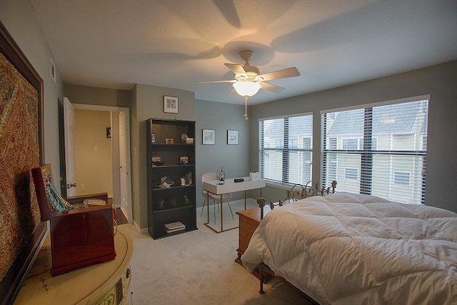 907 Davis Rd, League City, TX 77573 - carpeted bedroom with a ceiling fan