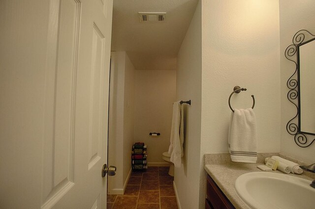 907 Davis Rd, League City, TX 77573 - bathroom featuring vanity, tile patterned flooring, and toilet