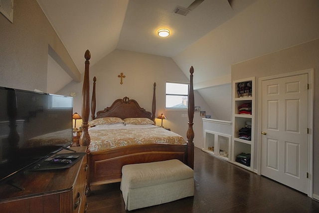 907 Davis Rd, League City, TX 77573 - bedroom with vaulted ceiling and dark wood-style flooring
