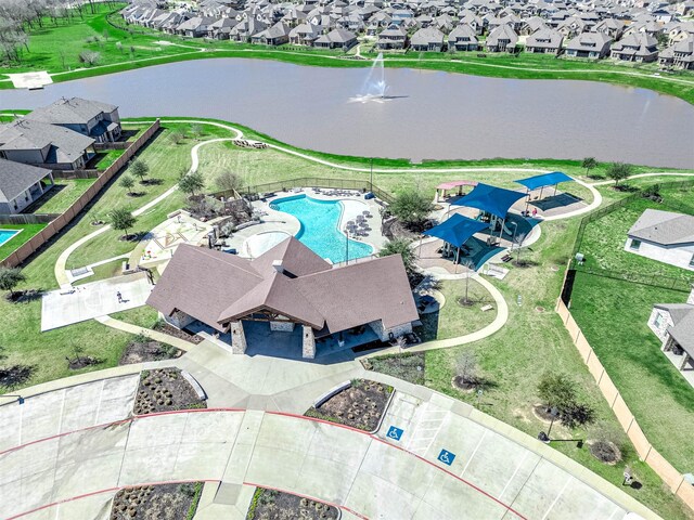32322 Dusted Bronze Dr, Brookshire, TX 77423 - aerial perspective of suburban area with a large body of water and a pool area