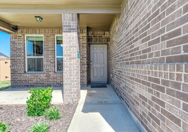 32322 Dusted Bronze Dr, Brookshire, TX 77423 - doorway to property featuring brick siding