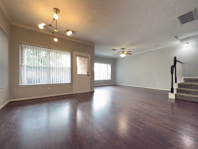 5227 Brinkman Ct, Houston, TX 77091 - unfurnished living room featuring ornamental molding, dark wood-type flooring, stairway, a textured ceiling, and ceiling fan