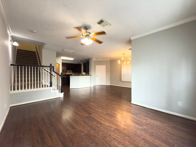 5227 Brinkman Ct, Houston, TX 77091 - unfurnished living room with ornamental molding, stairs, a chandelier, dark wood-style flooring, and ceiling fan