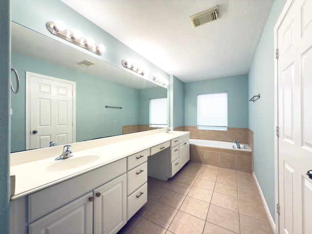 5227 Brinkman Ct, Houston, TX 77091 - full bath featuring vanity, a bath, and tile patterned flooring