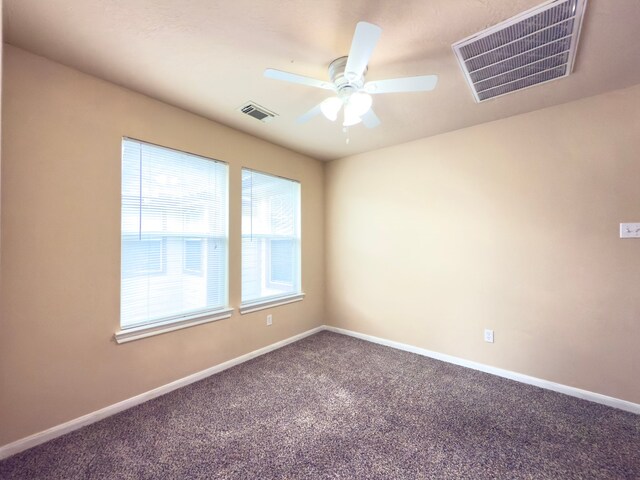 5227 Brinkman Ct, Houston, TX 77091 - empty room with carpet, a ceiling fan, and baseboards