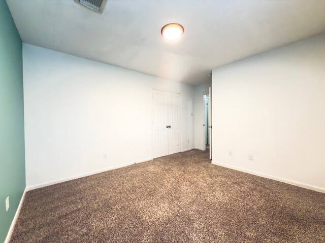 5227 Brinkman Ct, Houston, TX 77091 - unfurnished room with dark colored carpet and baseboards