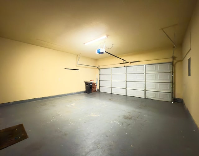 5227 Brinkman Ct, Houston, TX 77091 - garage with a garage door opener and baseboards