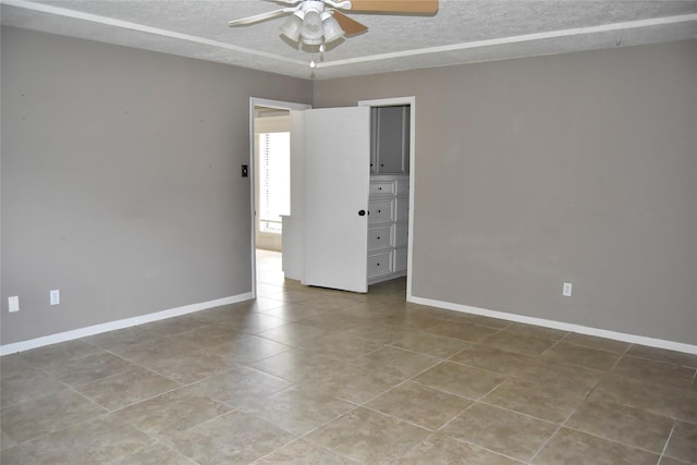 18318 Ella Blvd, Spring, TX 77388 - tiled spare room featuring ceiling fan, a textured ceiling, and baseboards