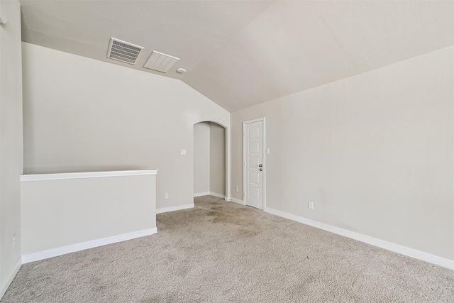 350 Selah Ct, Alvin, TX 77511 - unfurnished room with lofted ceiling, carpet floors, and arched walkways