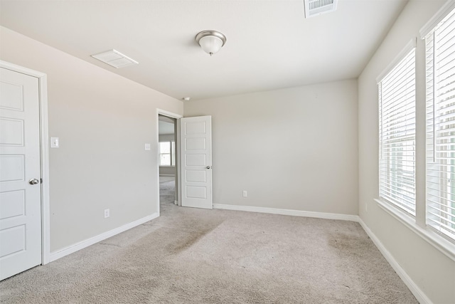 350 Selah Ct, Alvin, TX 77511 - carpeted spare room featuring plenty of natural light