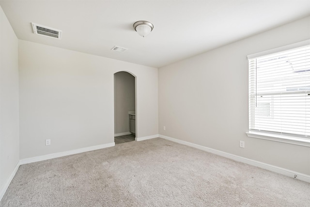 350 Selah Ct, Alvin, TX 77511 - carpeted spare room featuring arched walkways and healthy amount of natural light