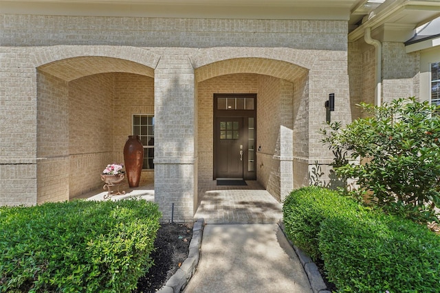 15 River Ridge Loop, The Woodlands, TX 77389 - doorway to property with brick siding