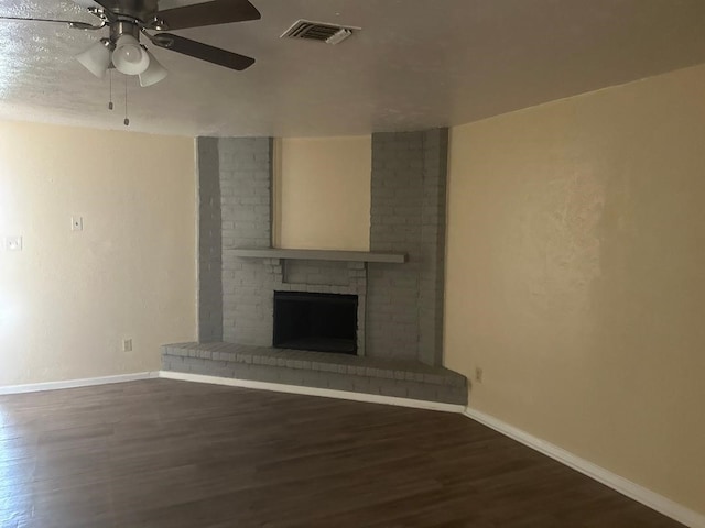 6322 Purple Sage Rd, Houston, TX 77049 - unfurnished living room with baseboards, wood finished floors, a ceiling fan, and a fireplace