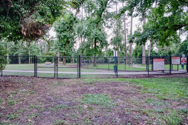 1726 Havelock Dr, Spring, TX 77386 - view of tennis court with a gate