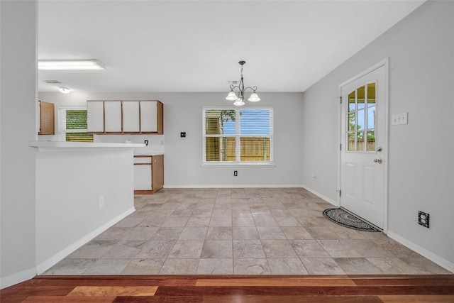 1726 Havelock Dr, Spring, TX 77386 - kitchen with plenty of natural light, a chandelier, light countertops, and decorative light fixtures