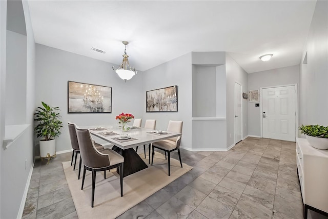 1726 Havelock Dr, Spring, TX 77386 - dining area featuring light marble finish floors and a chandelier