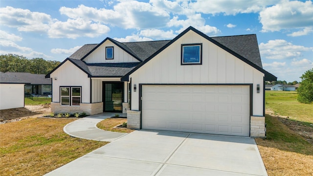 42 Meadow Lake Dr, Trinity, TX 75862 - modern farmhouse style home with a shingled roof, board and batten siding, concrete driveway, and a front lawn