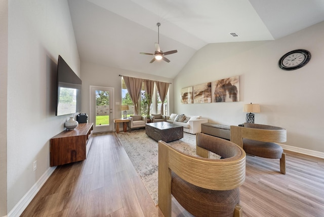 29023 Laurel Grove Ln, Fulshear, TX 77441 - living room featuring high vaulted ceiling, ceiling fan, baseboards, and wood finished floors