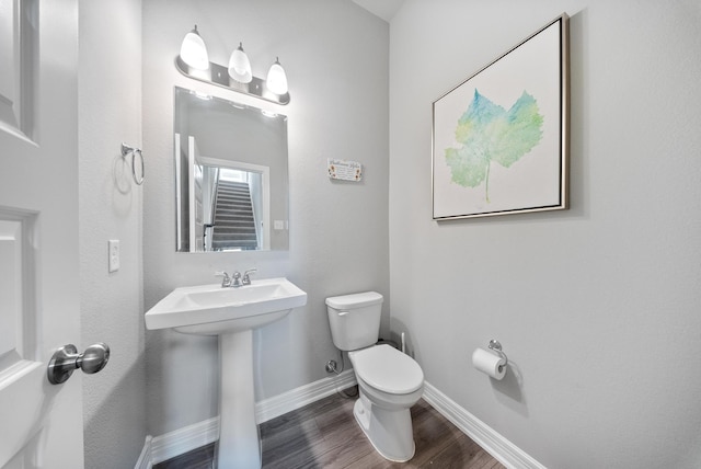 29023 Laurel Grove Ln, Fulshear, TX 77441 - bathroom with toilet, wood finished floors, baseboards, and a sink