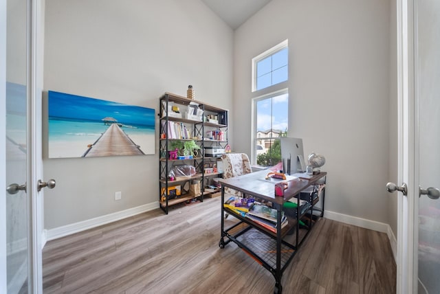29023 Laurel Grove Ln, Fulshear, TX 77441 - office area featuring french doors, wood finished floors, baseboards, and a high ceiling