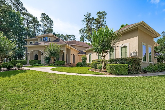 15 W Shore Dr, Montgomery, TX 77356 - mediterranean / spanish-style house with stucco siding and a front yard