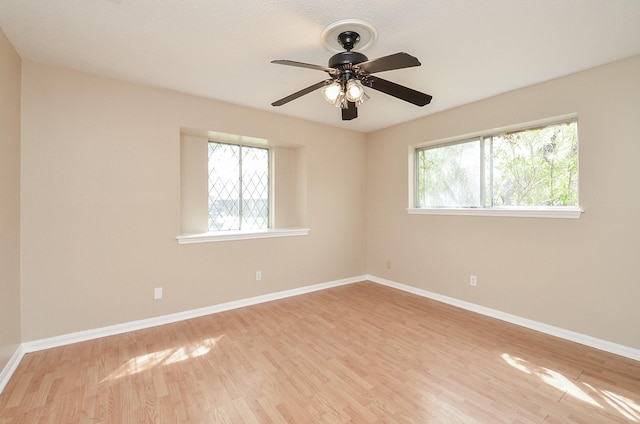11703 Easterling Dr, Houston, TX 77065 - spare room with wood finished floors, baseboards, and a ceiling fan
