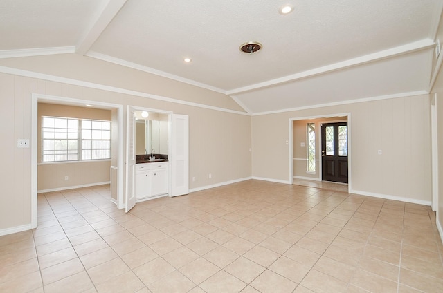 11703 Easterling Dr, Houston, TX 77065 - empty room featuring healthy amount of natural light, light tile patterned floors, baseboards, and a sink