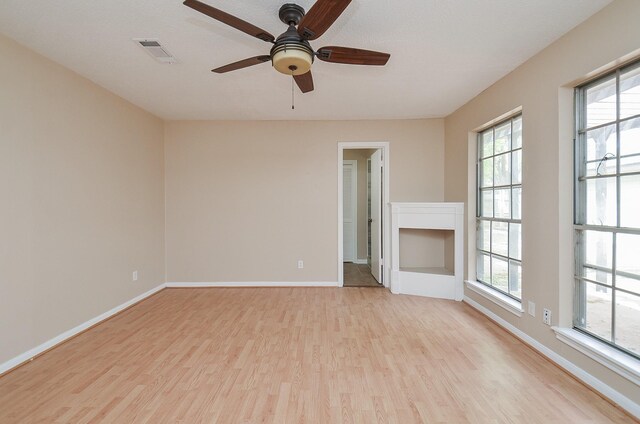 11703 Easterling Dr, Houston, TX 77065 - spare room featuring light wood-style floors, baseboards, and ceiling fan