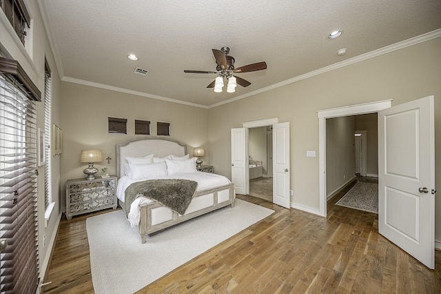 1239 W 22nd St Unit C, Houston, TX 77008 - bedroom with crown molding, wood finished floors, baseboards, a ceiling fan, and recessed lighting