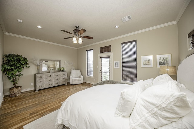 1239 W 22nd St Unit C, Houston, TX 77008 - bedroom featuring wood finished floors, ornamental molding, a ceiling fan, recessed lighting, and baseboards