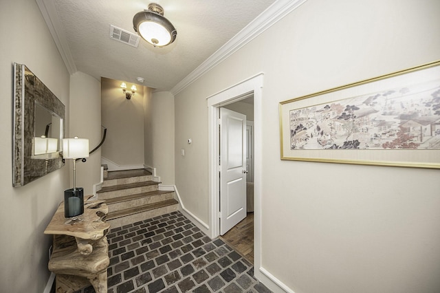 1239 W 22nd St Unit C, Houston, TX 77008 - hallway with brick floors, baseboards, ornamental molding, stairway, and a textured ceiling