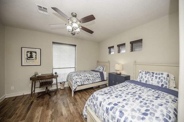 1239 W 22nd St Unit C, Houston, TX 77008 - bedroom with dark wood finished floors, baseboards, and a ceiling fan