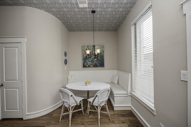 1239 W 22nd St Unit C, Houston, TX 77008 - dining room featuring breakfast area, dark wood finished floors, a chandelier, and an ornate ceiling