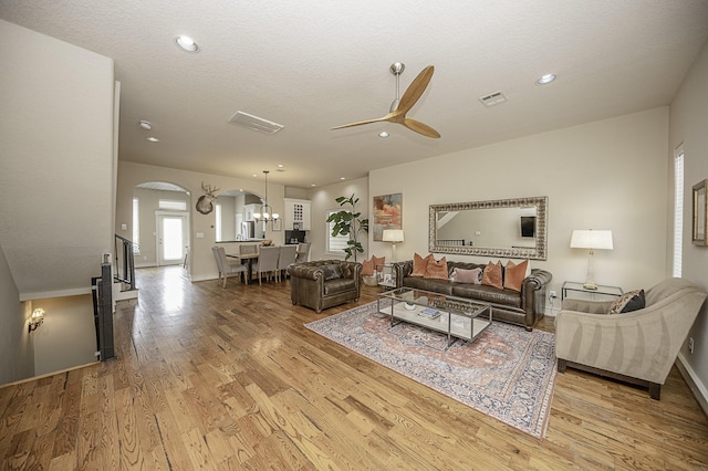 1239 W 22nd St Unit C, Houston, TX 77008 - living area with arched walkways, ceiling fan, light wood-style flooring, a chandelier, and recessed lighting